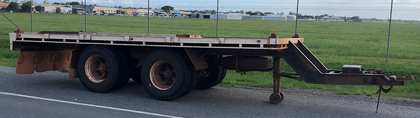 Image of side view of a pig trailer