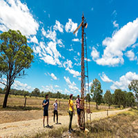 Persons looking at old train signaling