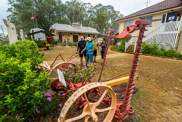 Several buildings, including a church and a sign that says "Brisbane Valley Rail Trail"