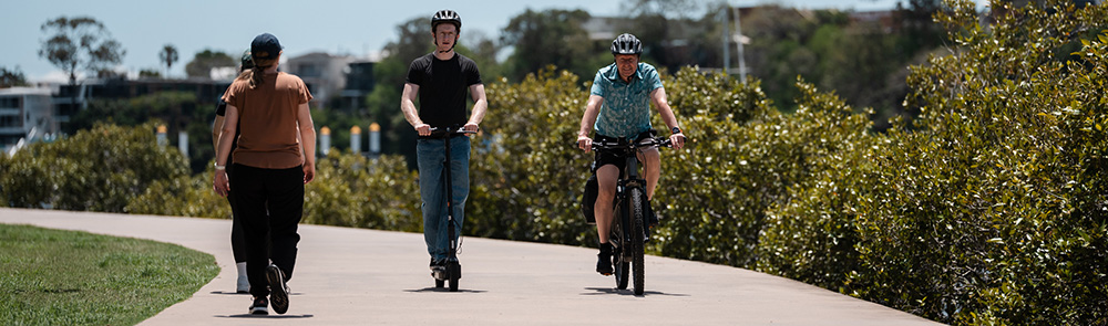 E-bike, e-scooter and walkers on a footpath