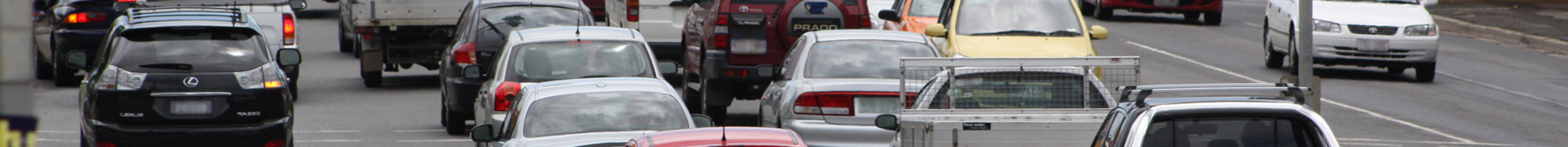 Cars on a highway on both sides of the road.