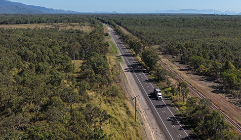 Image of a truck travelling on the completed section on Hencamp Creek Road Bruce Highway