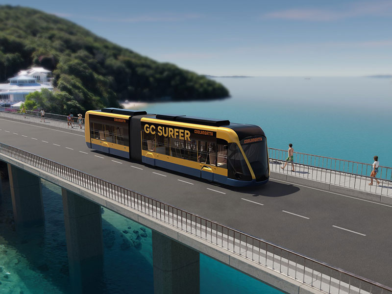Light rail vehicle traveling over a bridge