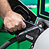Hand holding an electric vehicle charger