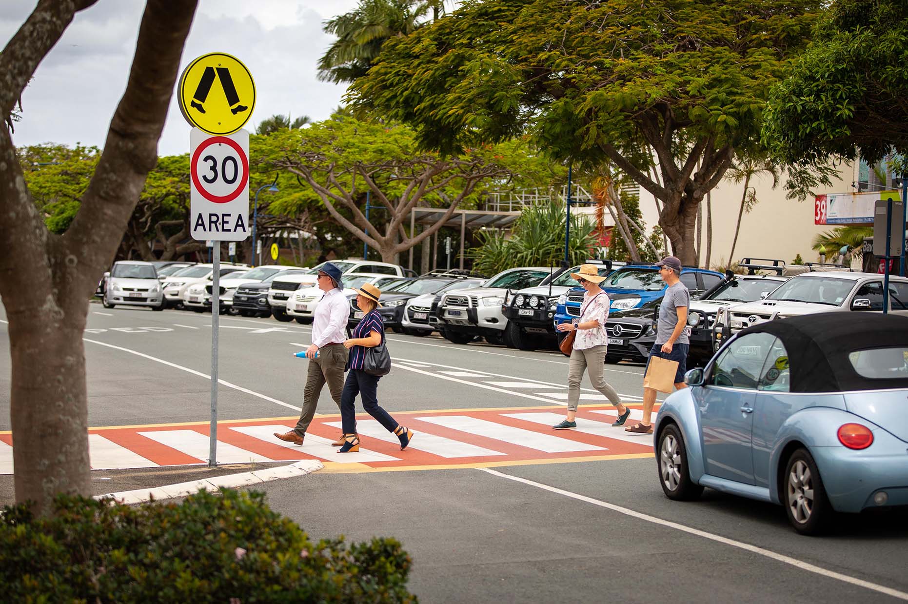 people walking through a crossing